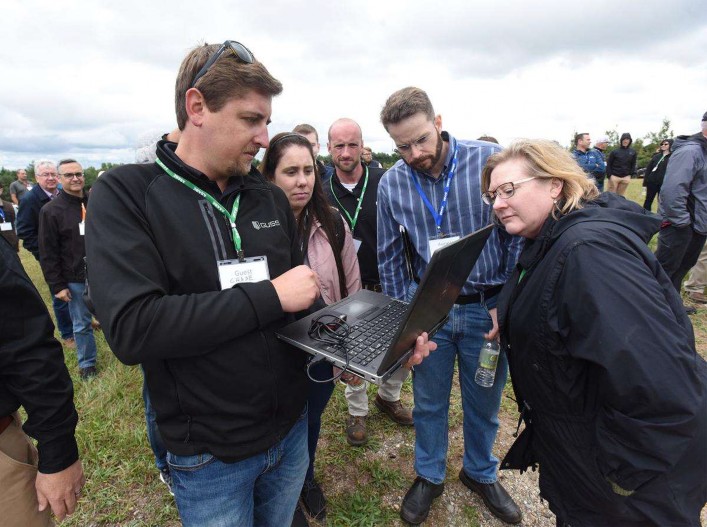 A laptop is used to remotely operate an unmanned spray vehicle